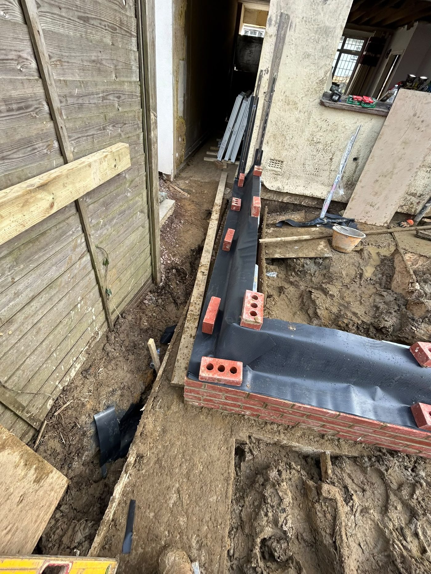 Footings and engineering brickwork to DPC